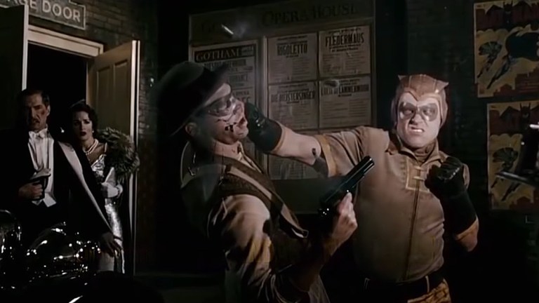 Nite Owl saving Thomas and Martha Wayne in Watchmen.