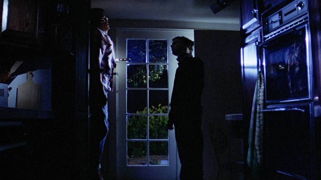 Michael Myers stares at victim in Halloween