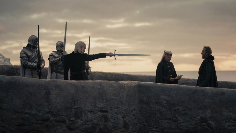 Prince Daemon Targaryen and Queen Rhaenyra Targaryen meet Ser Otto Hightower on a bridge in House of the Dragon season 1.