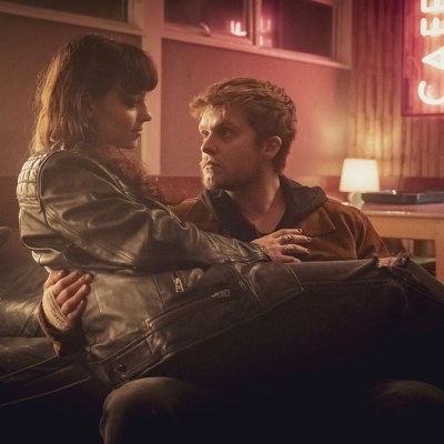 Amy sitting on Malachy's lap in BBC crime drama The Jetty