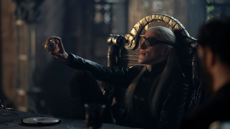 Aemond Targaryen (Ewan Mitchell) sits at the Small Council table in House of the Dragon season 2