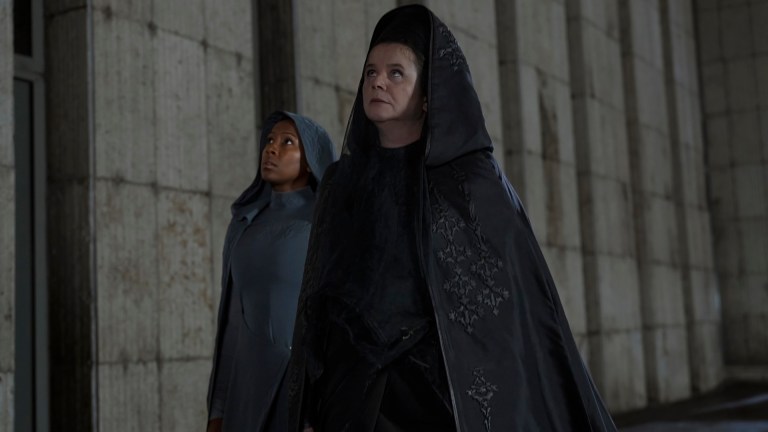 Sister Theodosia (Jade Anouka) and Valya Harkonnen (Emily Watson) walk down a hallway in Dune: Prophecy.