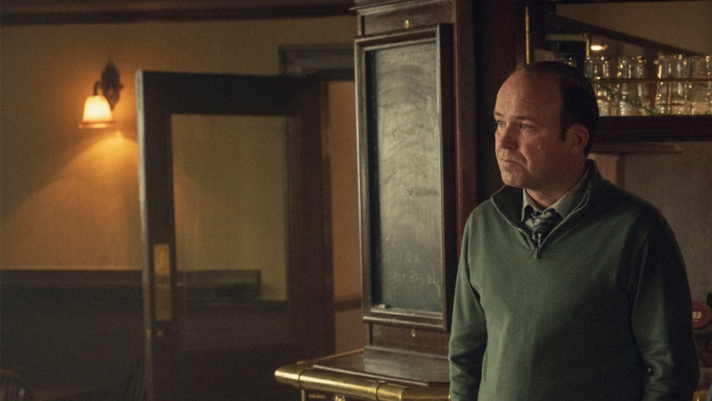 Rory Kinnear wearing a green jumper in a pub in Netflix's Toxic Town